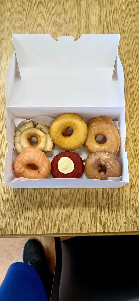 A half dozen assorted classic donuts in a Doughboys box