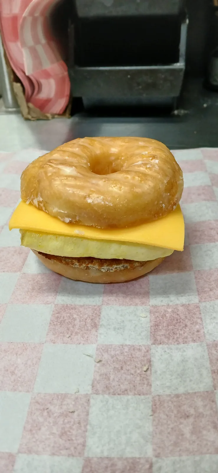 A Doughboys donut slider: a glazed donut split and filled with egg and cheese