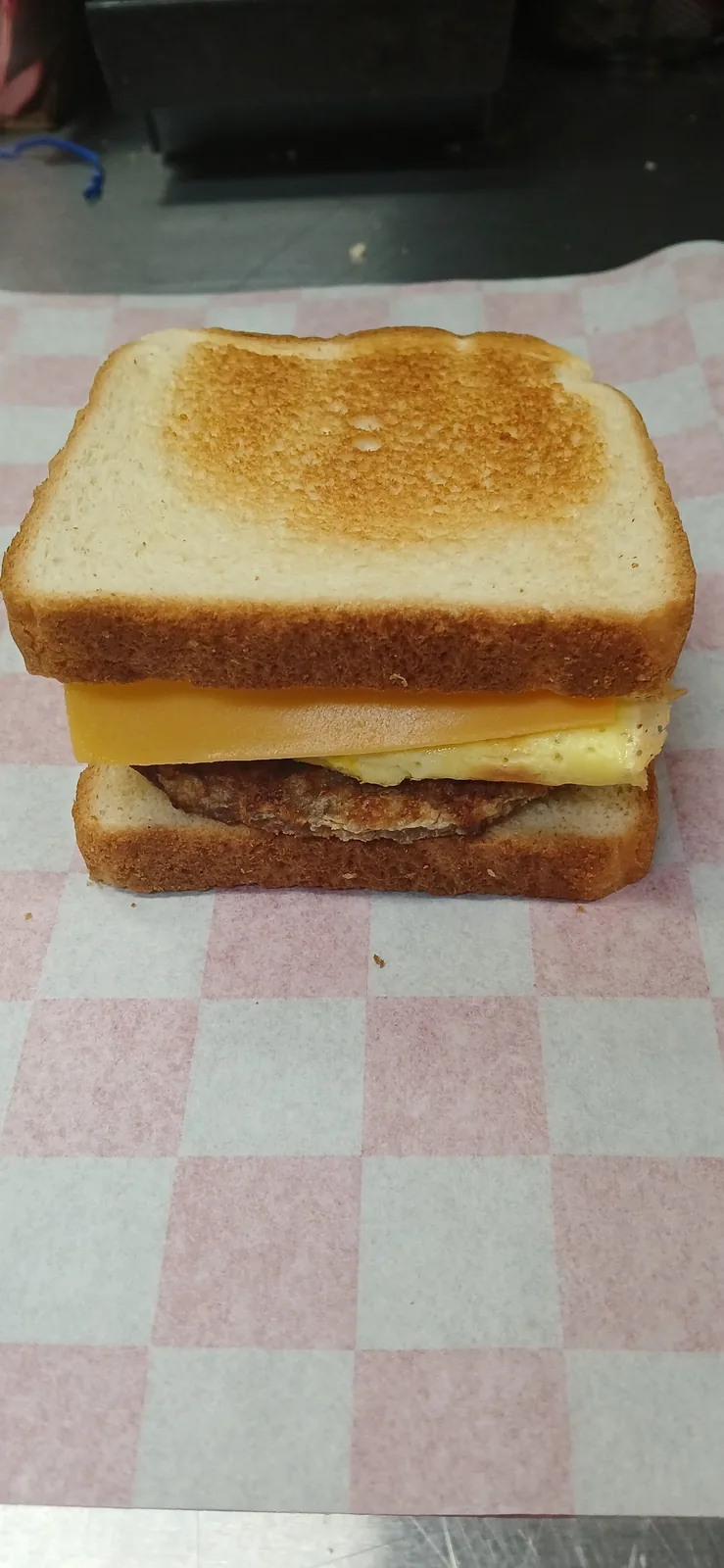A Texas toast breakfast sandwich with egg and cheese