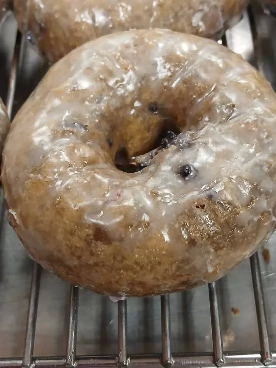 A glazed blueberry cake donut