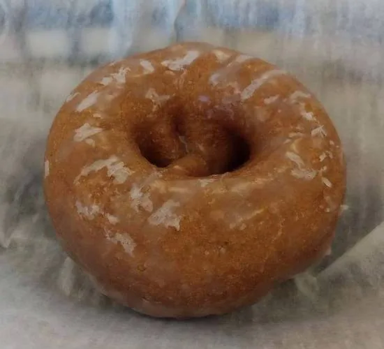 A glazed pumpkin cake donut